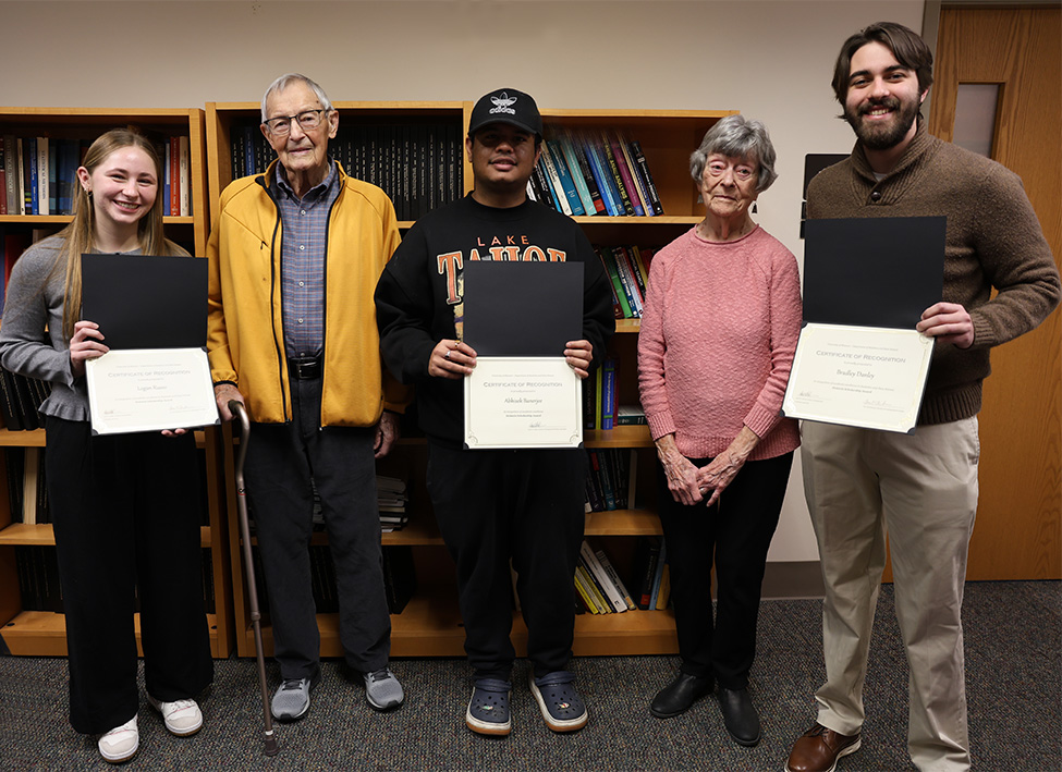 Jim and Mariann Holstein with scholarship recipients